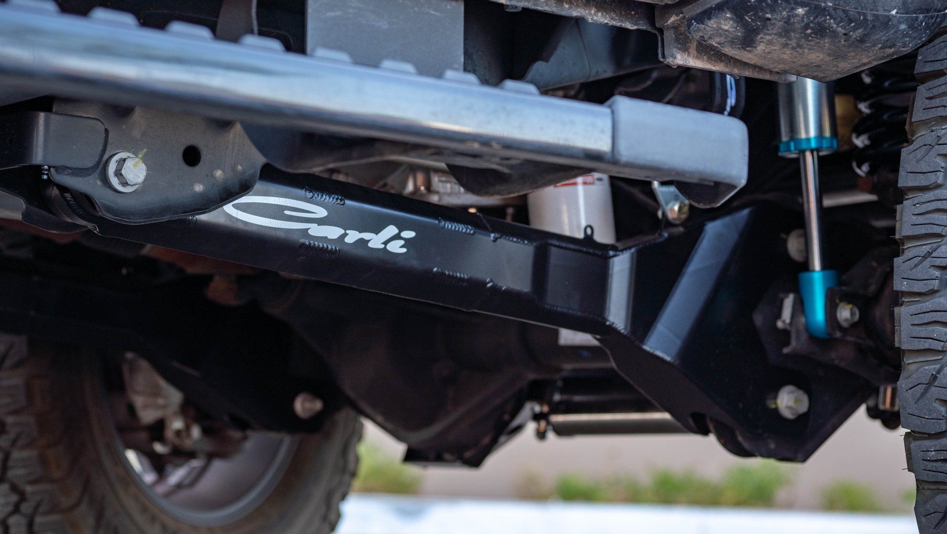 2023-2024 Ford F250/350 Carli Suspension Fabricated Radius Arms for 5.5" Lift Close-up Display on vehicle