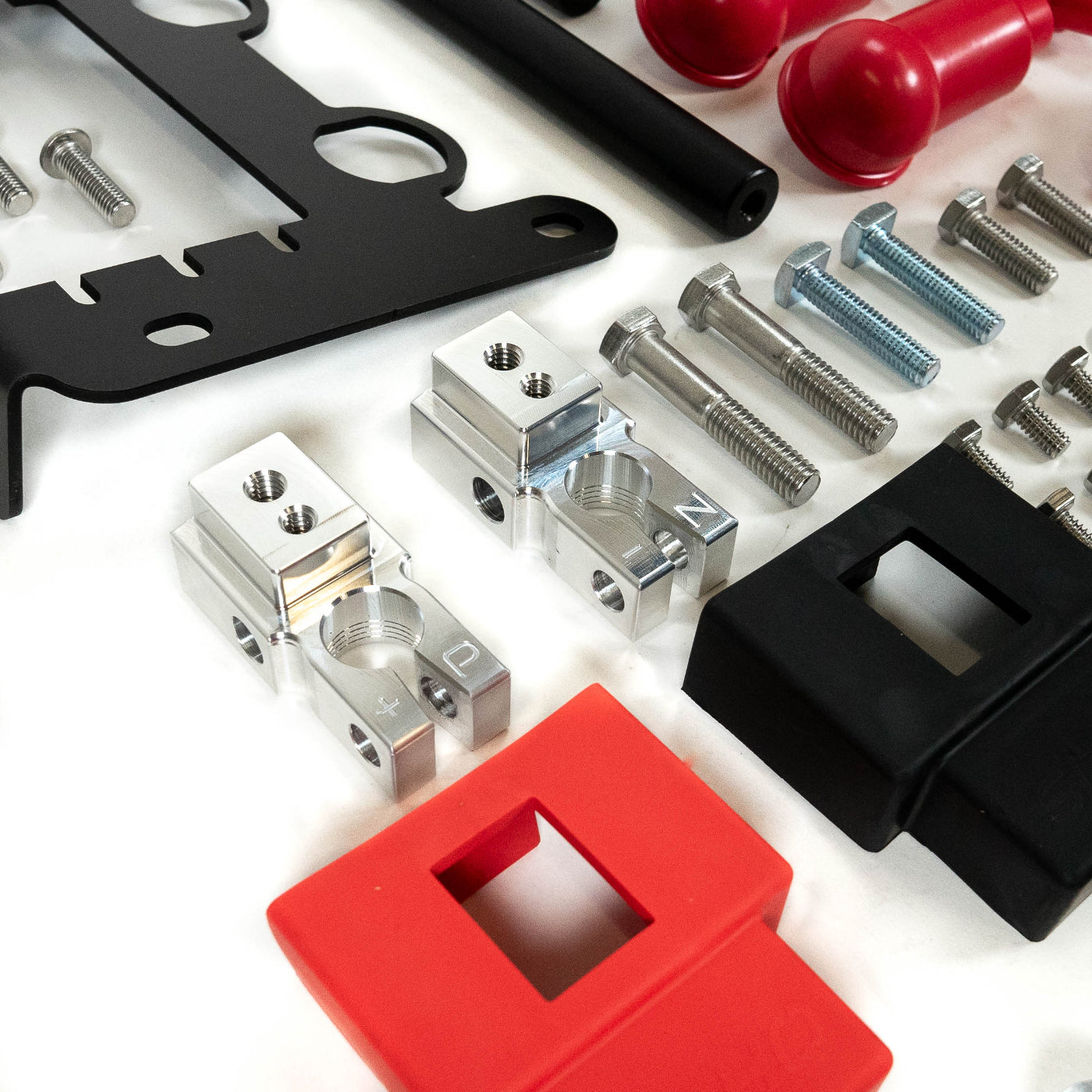 '24+ LC250 SDHQ Built Under Hood Power Solution Kit display of included parts and hardware - close-up