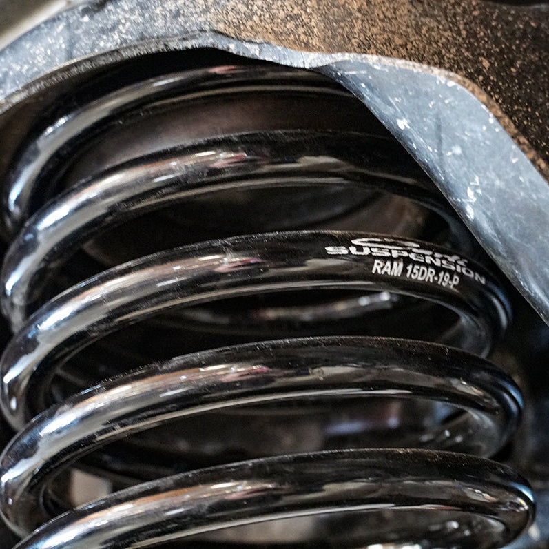 '19-24 Ram 1500 Rebel Carli Multi-Rate Rear Coil Springs Close-up Display on Vehicle