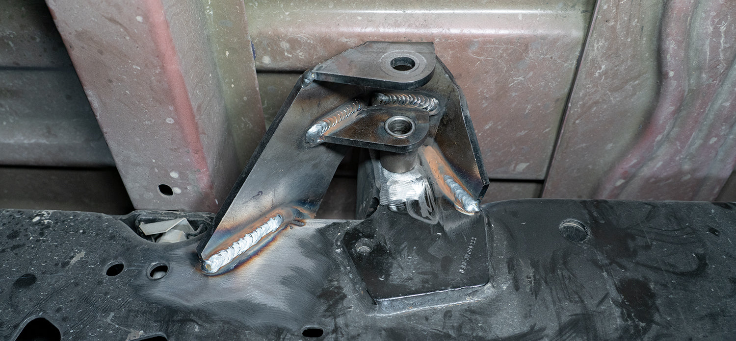 ‘17-24 Ford F250/350 Carli Weld-In Rear Shock Mounts Close-up Display on Vehicle