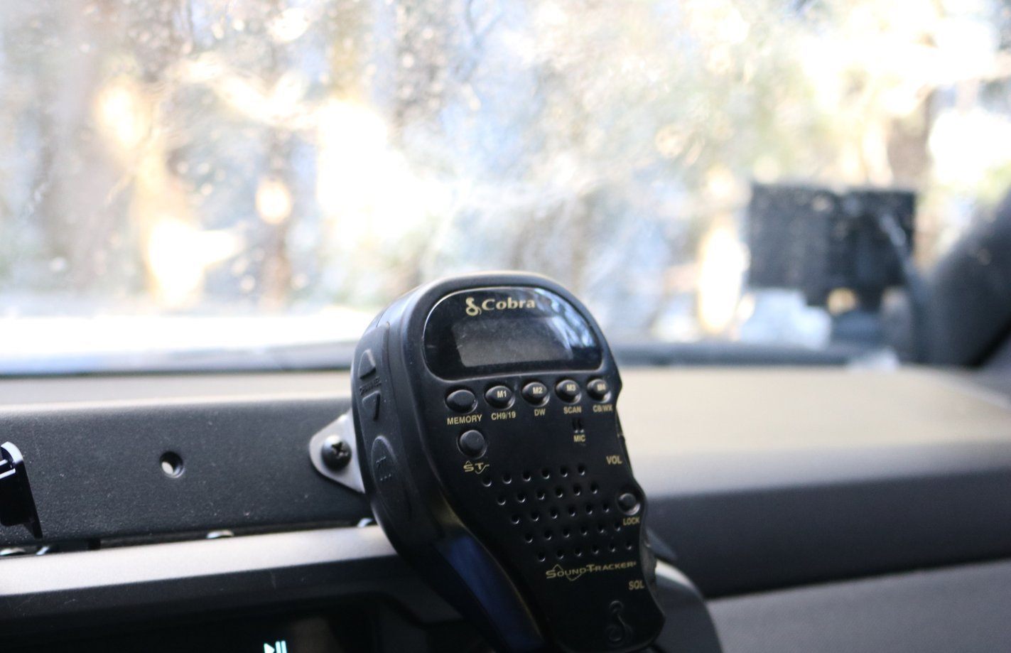 CB Mic and Handheld Radio Holder Close-up Display in vehicle