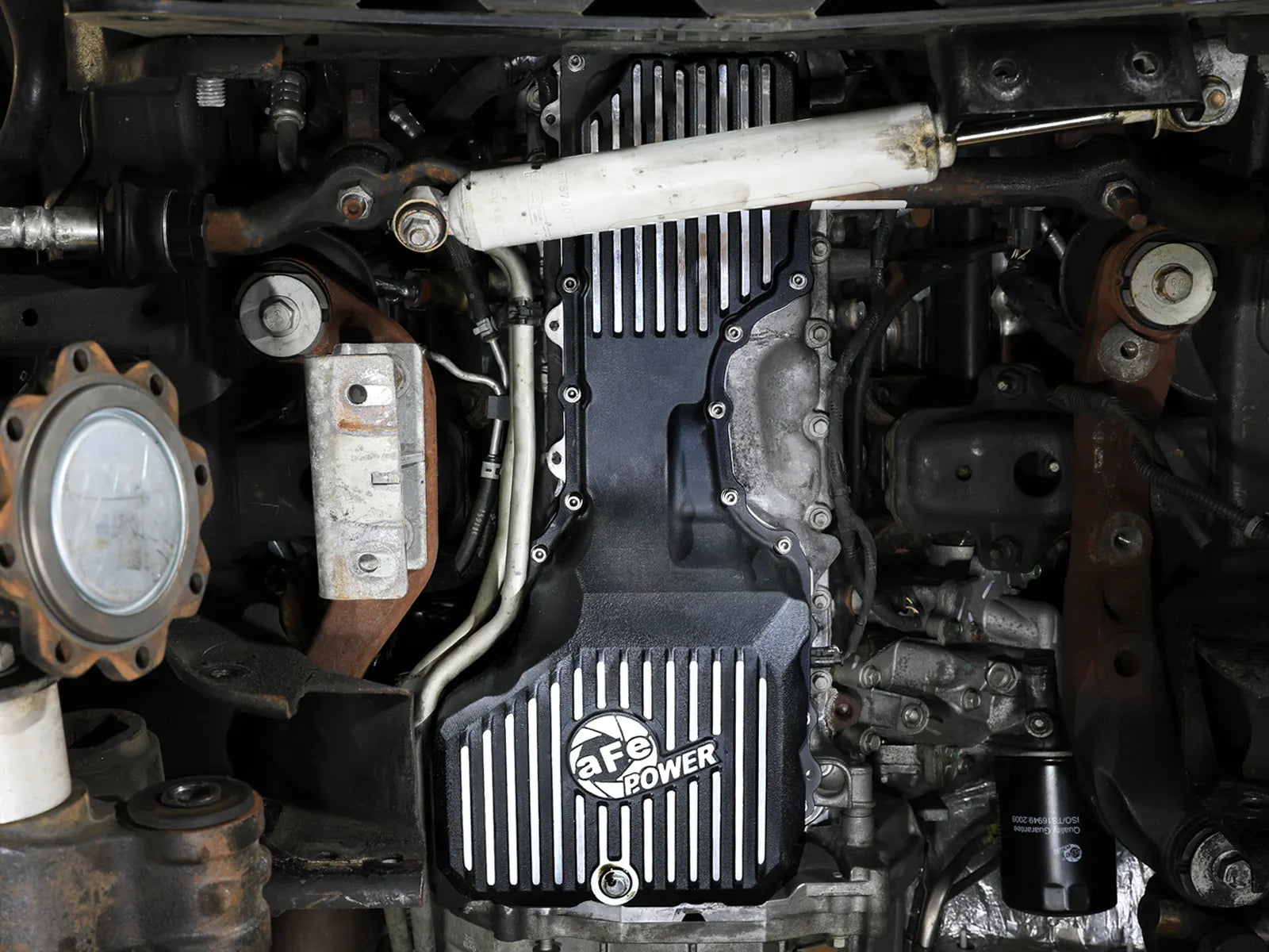 aFe POWER Pro Series Engine Oil Pan Black w/ Machined Fins GM Diesel Trucks 17-19 V8-6.6L (td) L5P Front View Black