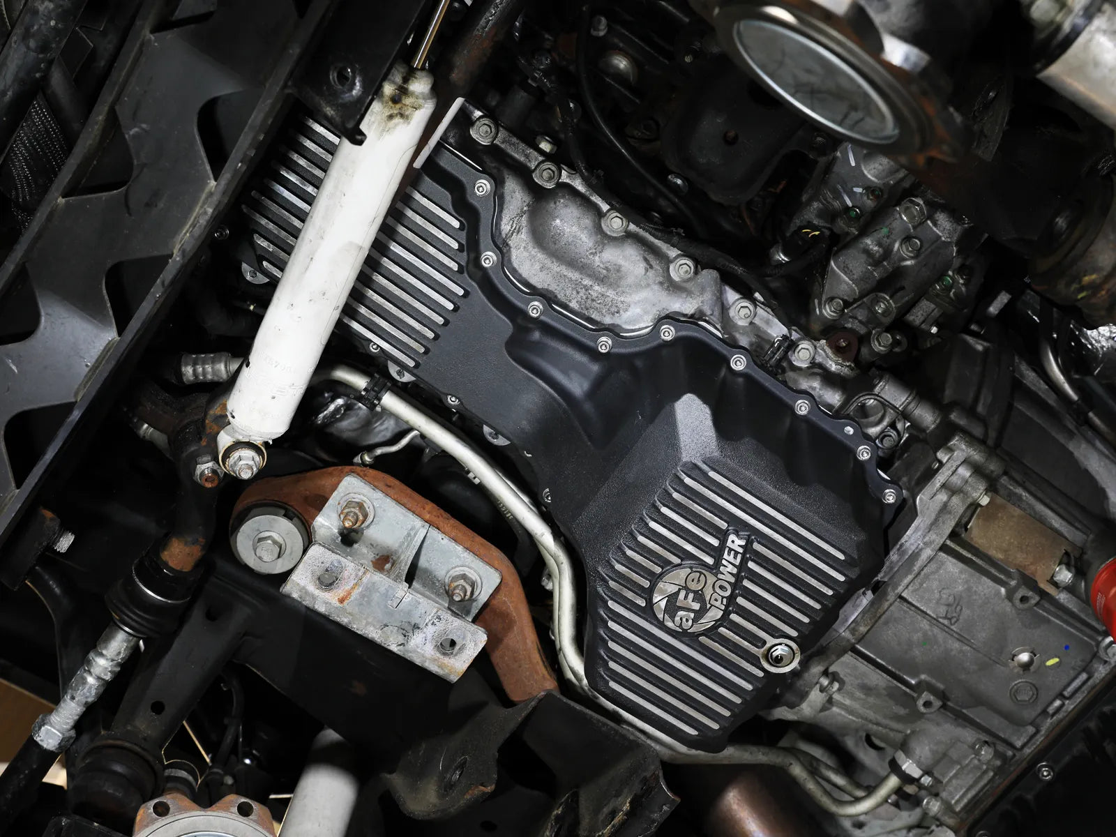 aFe POWER Pro Series Engine Oil Pan Black w/ Machined Fins GM Diesel Trucks 17-19 V8-6.6L (td) L5P Front View Black