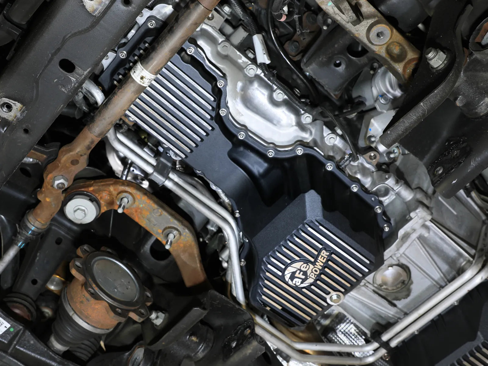 aFe POWER Pro Series Engine Oil Pan Black w/ Machined Fins GM Diesel Trucks 20-25 V8-6.6L (td) L5P Front View Black