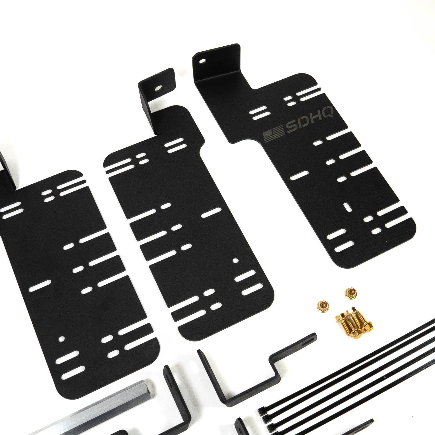 SDHQ Built '21-25 F150 / Raptor Behind the Grille Light Mounting Kit display of included parts and hardware 