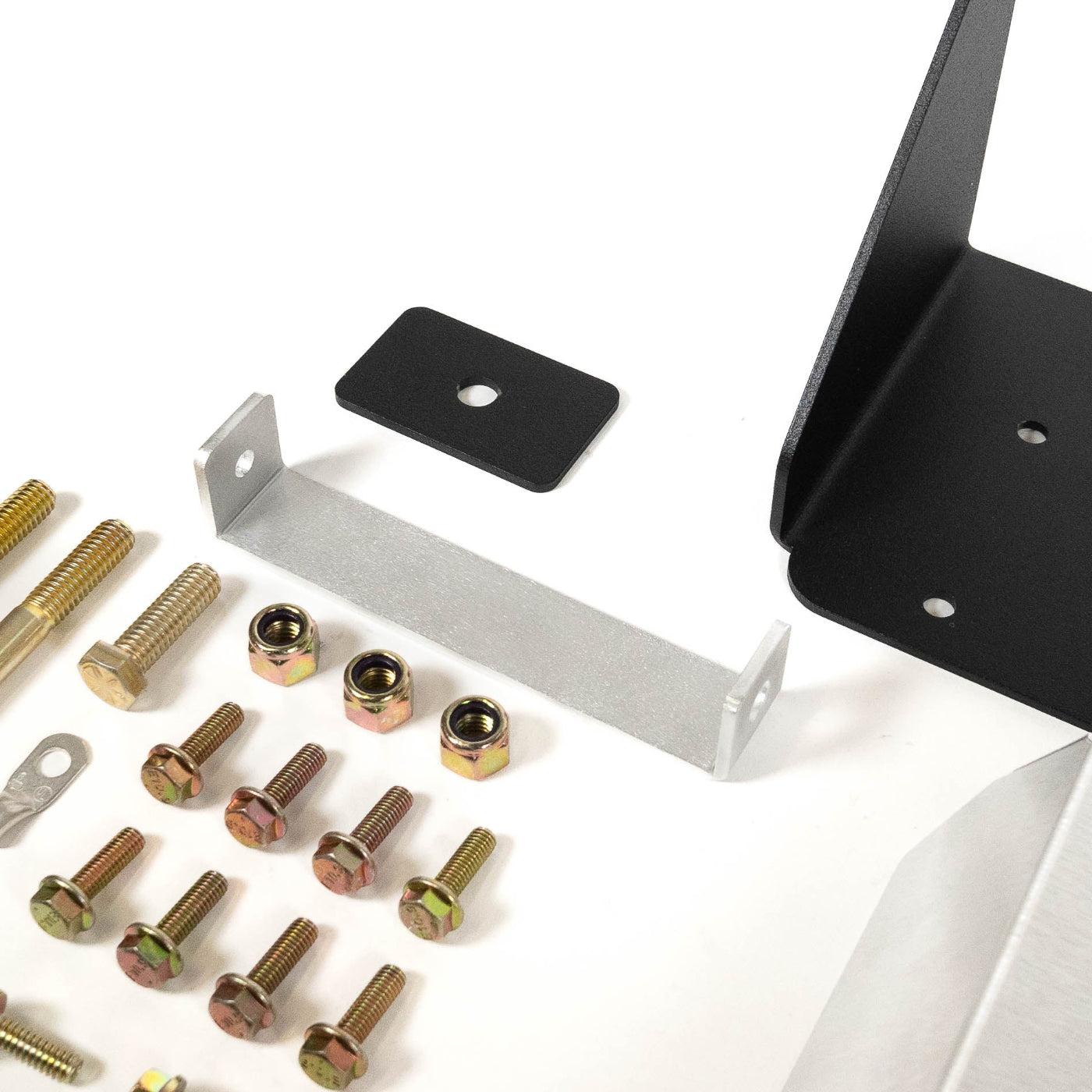 SDHQ Built 2024 LC250 ARB Twin Air Compressor Mount display of included parts and hardware - close-up 