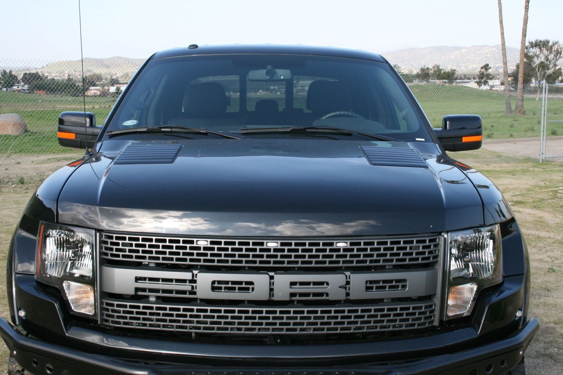 '10-14 Ford Raptor OEM Style Hood Fiberglass Fiberwerx (front view)