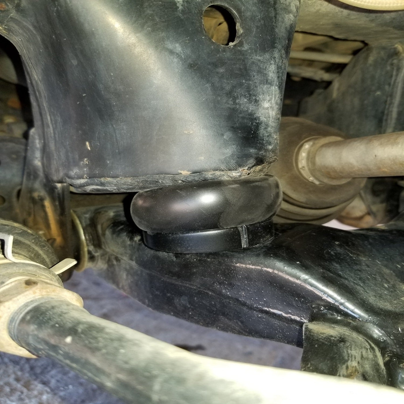 '89-95 Toyota Pickup DuroBumps Front Bump Stops - DBF24RPU Close-up Display on Vehicle 