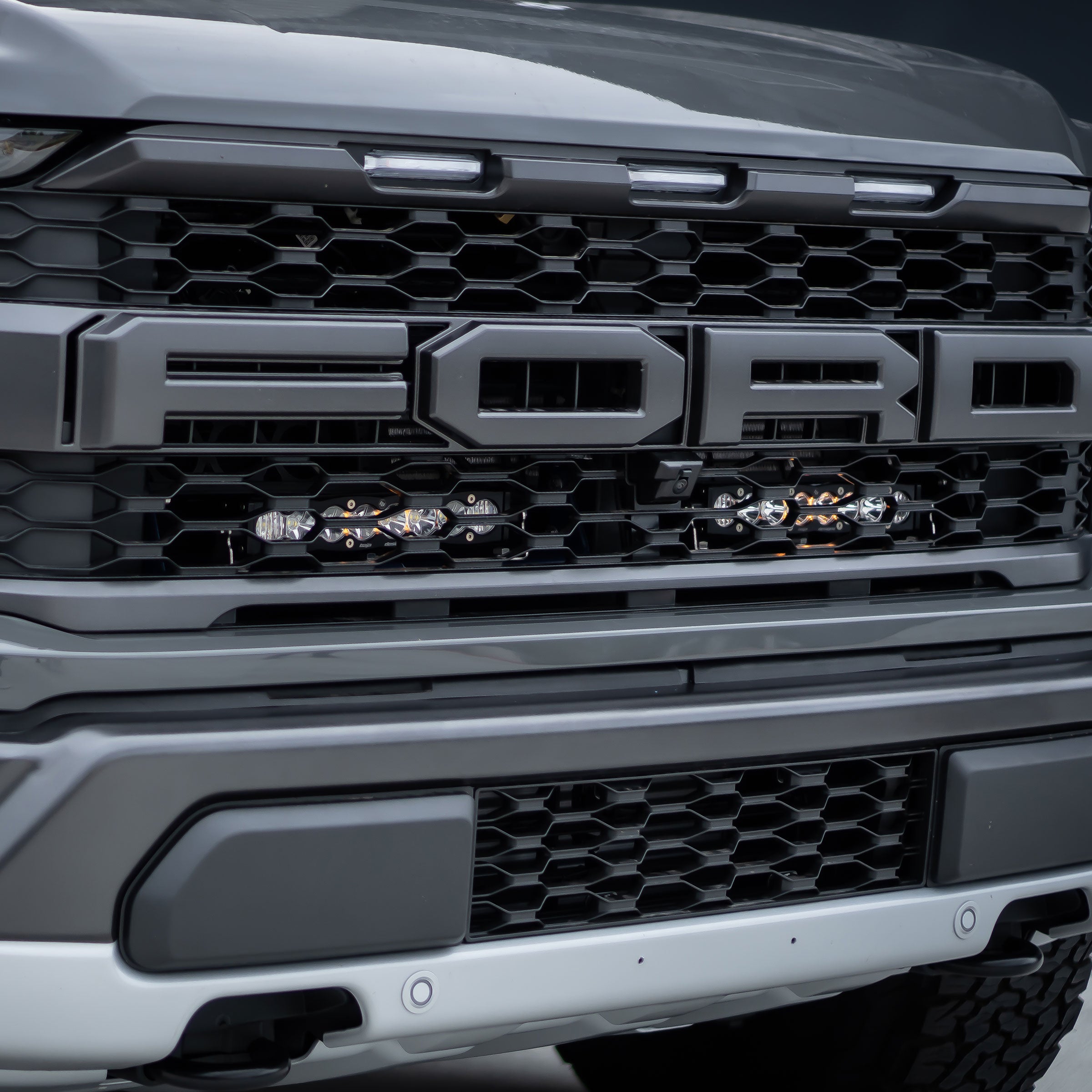 21 Current Ford Raptor Baja Designs S8 Light Bar Behind the Grille Kit